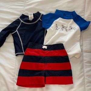 2 boy’s rash guards and 1 swim shorts